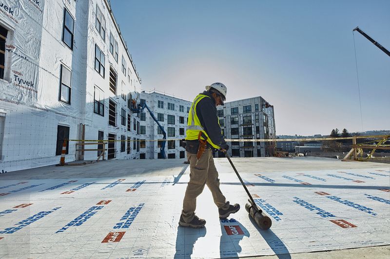 Roofer working on a commercial flat roof